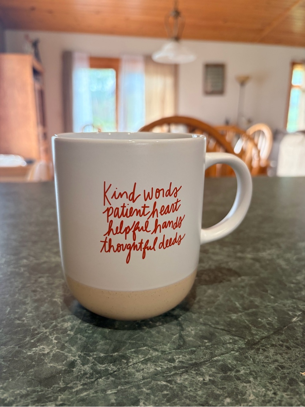 White Ceramic Mug with Red Script and Cream Base